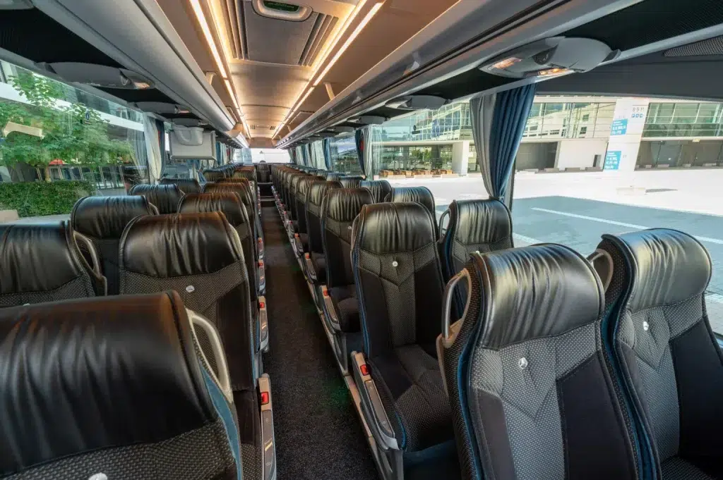 Black leather interior of a luxury coach for high class transport and vip services.